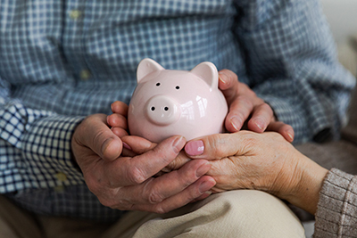 couple holding a piggy bank